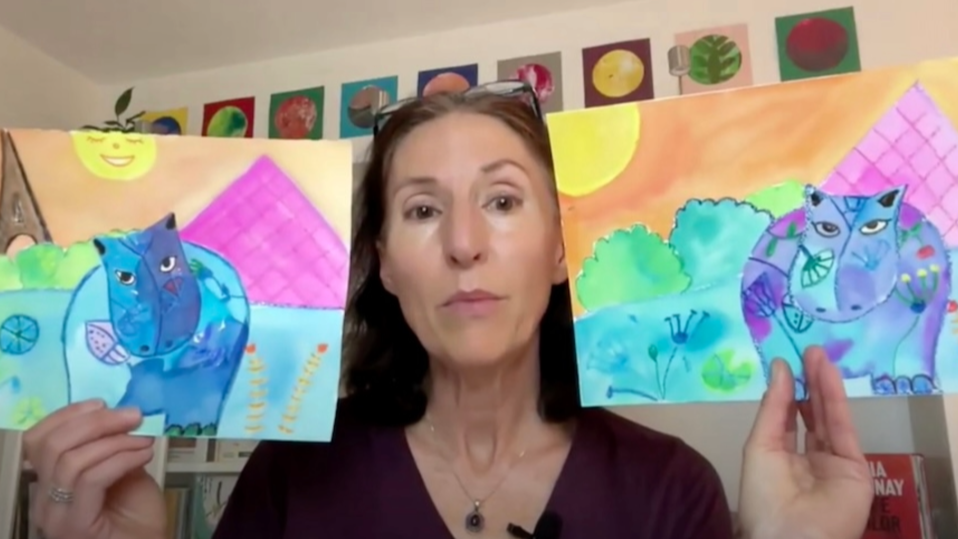 Michele Debuisne showing student artwork during a live online lesson