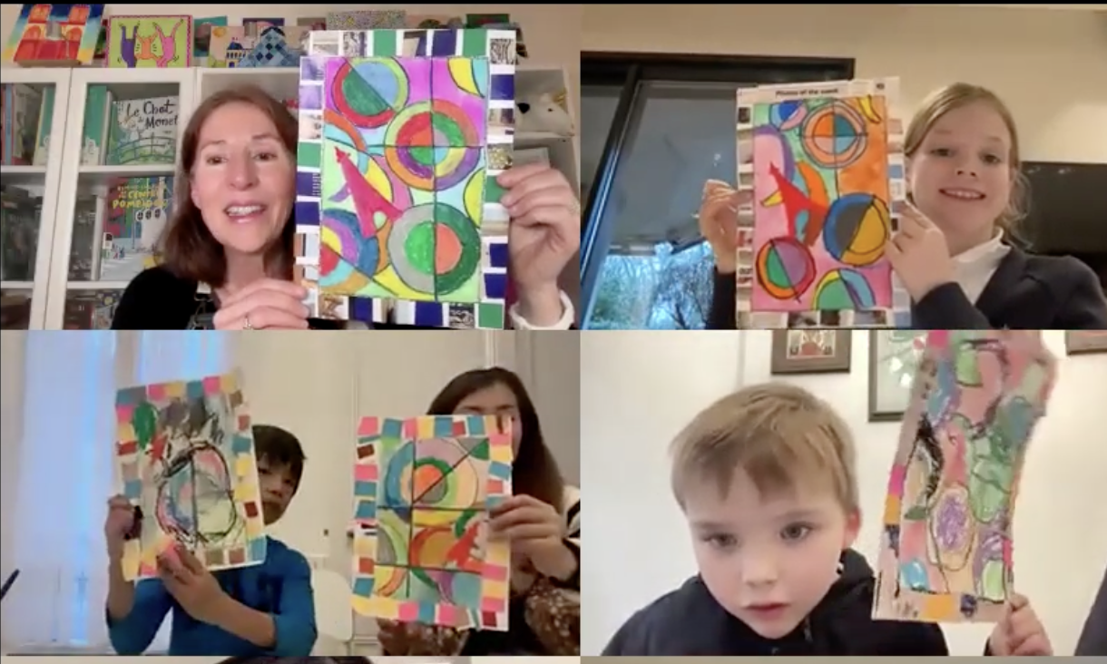 Children participating in a live online art club class